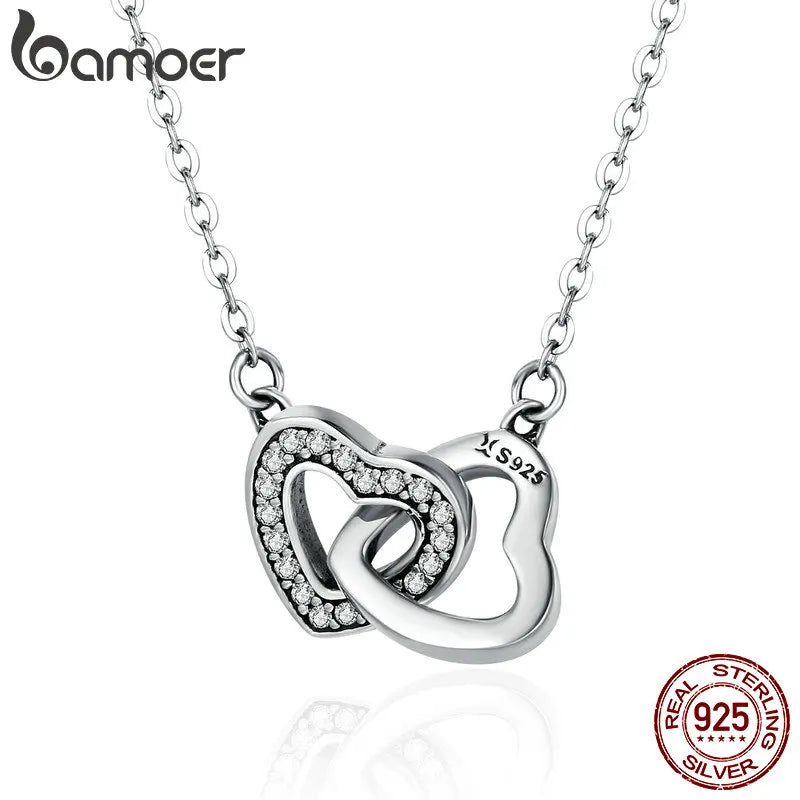 Collier et pendentif en argent avec cœurs entrelacés