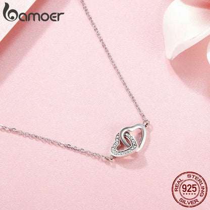 Collier et pendentif en argent avec cœurs entrelacés